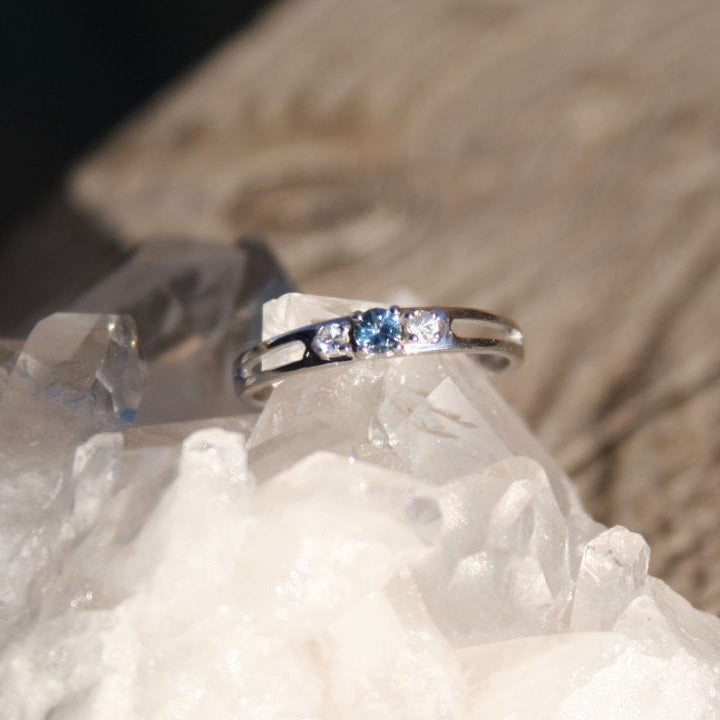 Blue Rock Creek Montana Sapphire with white sapphire accents ring on crystal