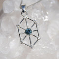 Blue Montana sapphire with white sapphire accents in geometric art-deco design