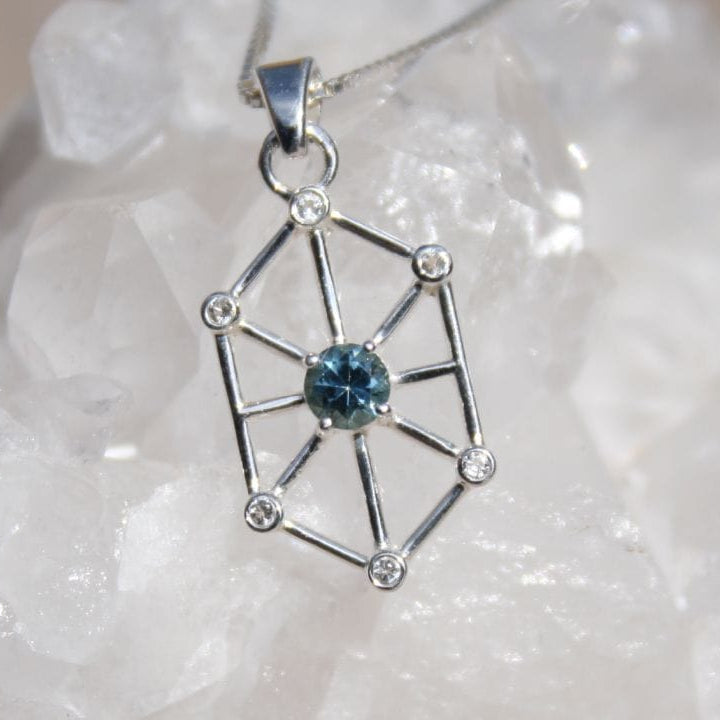 Blue Montana sapphire with white sapphire accents in geometric art-deco design