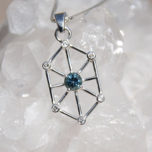 Blue Montana sapphire with white sapphire accents in geometric art-deco design