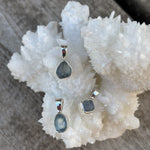 blue hued uncut sapphire pendant