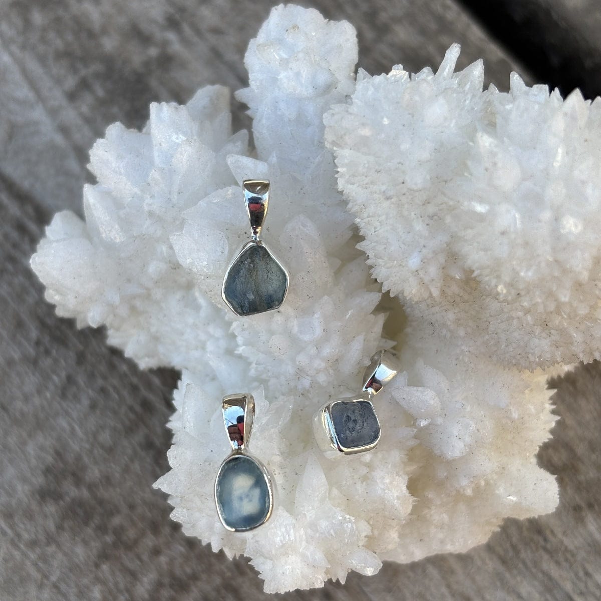 blue hued uncut sapphire pendant