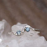 two blue Montana sapphires in detailed band ring. 