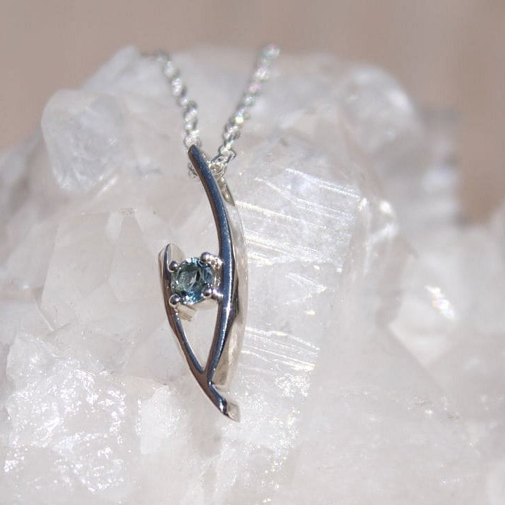 Silver pendant necklace with blue montana sapphire in modern design