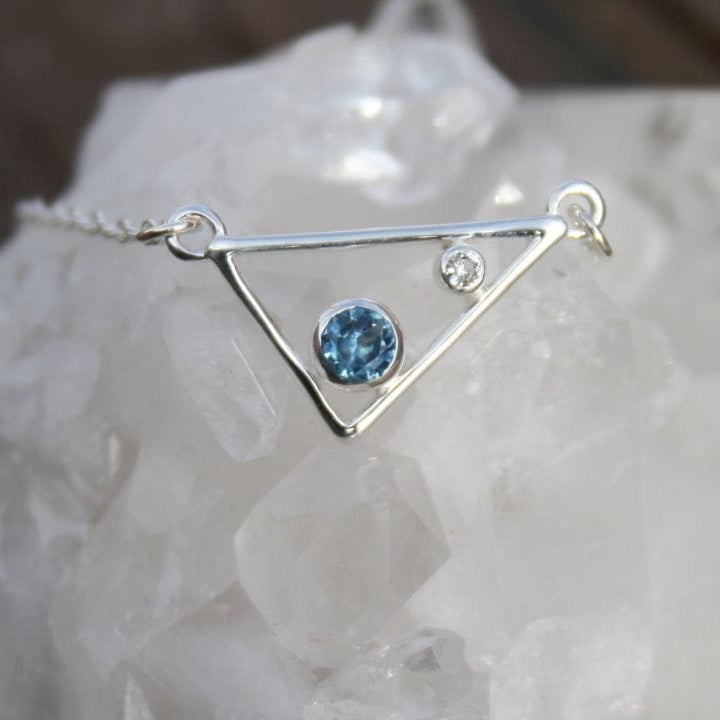 Silver triangle pendant necklace with blue Montana sapphire and white sapphire accent