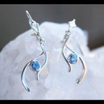 Silver earrings with blue Montana sapphires in a wavy design